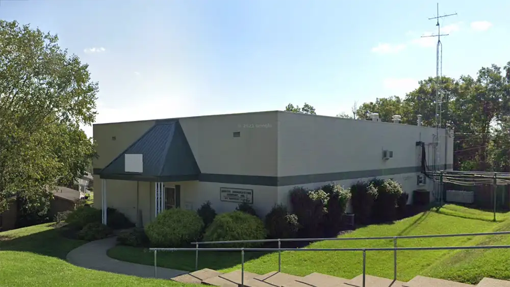 Exterior of Bristol Broadcasting’s offices and studios, 817 Suncrest Place, Charleston, W.Va.; single-story building with small tower.