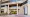 ntrance to 65 East State Street, with tall columns, glass doors and a tenant directory listing Ohio Auditor of State Keith Faber.