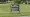 A black sign on a grassy lawn reads “East Pike Elementary School” and “Indiana Area School District Administrative Offices.”