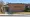 Brick school district office with green “Seminole County Board of Education” lettering and a covered walkway leading to the entrance.