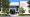 Trees frame the glass entrance of a white building marked “Seminole County Courthouse.”